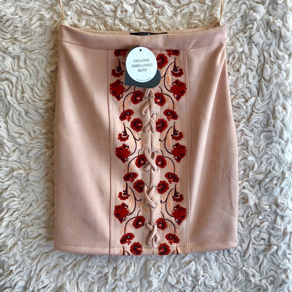 New with tags, light pink mini skirt